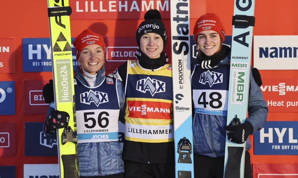 From left, Germany's Katharina Schmid, Slovenia's Nika Prevc and Germany's Selina Freitag pose on the podium after the Women's Individual HS140 competition at the ski jumping world cup in Lillehammer, Norway, Saturday, Nov. 23, 2024 (Geir Olsen/NTB Scanpix via AP)