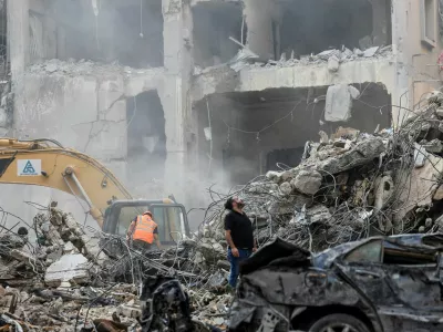 Civil defense members and rescuers work at the site of an Israeli strike in Beirut's Basta neighbourhood, amid the ongoing hostilities between Hezbollah and Israeli forces, Lebanon November 23, 2024. REUTERS/Thaier Al-Sudani   TPX IMAGES OF THE DAY