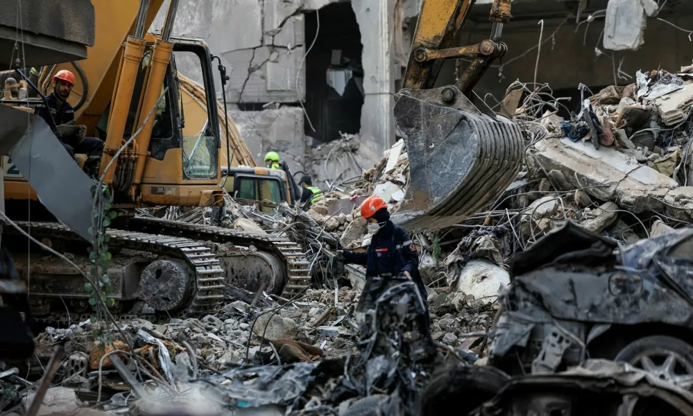 Civil defense members and rescuers work at the site of an Israeli strike in Beirut's Basta neighbourhood, amid the ongoing hostilities between Hezbollah and Israeli forces, Lebanon November 23, 2024. REUTERS/Thaier Al-Sudani