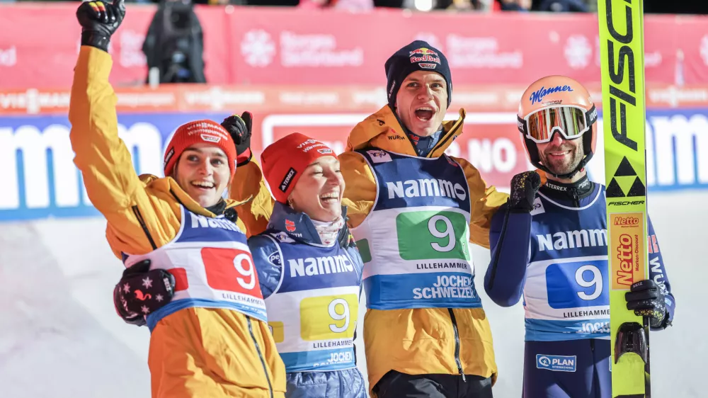 22 November 2024, Norway, Lillehammer: (L-R) Germany's Selina Freitag, Katharina Schmid, Andreas Wellinger and Pius Paschke celebrate wining the mixed team competition of the FIS Ski Jumping World Cup Mixed at the Lysgardsbakken. Photo: Geir Olsen/NTB/dpa