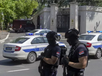 Police officers block off traffic at an intersection close to the Israeli embassy in Belgrade, Serbia, Saturday, June 29, 2024. An attacker with a crossbow has wounded a Serbian police officer guarding the Israeli Embassy in Belgrade. Serbia's interior ministry says the officer responded by fatally shooting the assailant. (AP Photo/Marko Drobnjakovic)