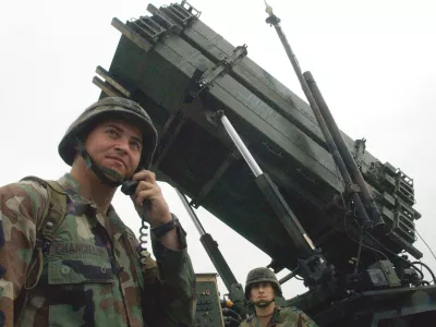 ** FILE ** A U.S Army soldier uses a radio near a Patriot Advanced Capability-3 missile system at a Korean military air base in Suwon, south of Seoul, Thursday, Sept. 18, 2003. Tokyo and Washington will deploy advanced Patriot interceptor missiles in Japan for the first time, officials said Monday, June 26, 2006 amid concerns North Korea may be preparing to test-fire a long-range ballistic missile. (AP Photo/Ahn Young-joon)