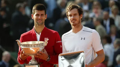 FILE - Serbia's Novak Djokovic, left, and Britain's Andy Murray holds their trophy after their final match of the French Open tennis tournament at the Roland Garros stadium, Sunday, June 5, 2016 in Paris.  (AP Photo/Alastair Grant, File)