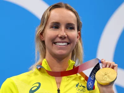 FILE PHOTO: Tokyo 2020 Olympics - Swimming - Women's 100m Freestyle - Medal Ceremony - Tokyo Aquatics Centre - Tokyo, Japan - July 30, 2021. Emma McKeon of Australia poses on the podium with the gold medal REUTERS/Marko Djurica/File Photo