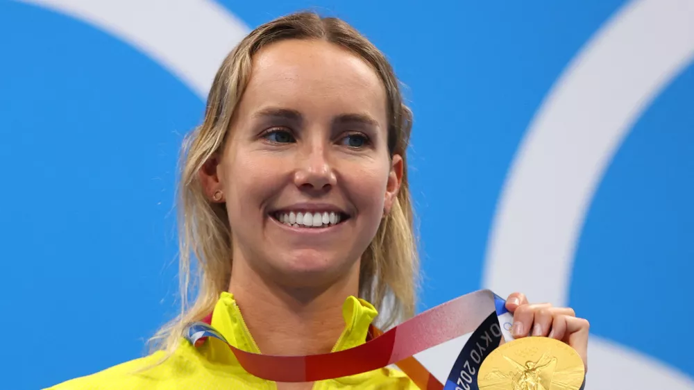 FILE PHOTO: Tokyo 2020 Olympics - Swimming - Women's 100m Freestyle - Medal Ceremony - Tokyo Aquatics Centre - Tokyo, Japan - July 30, 2021. Emma McKeon of Australia poses on the podium with the gold medal REUTERS/Marko Djurica/File Photo