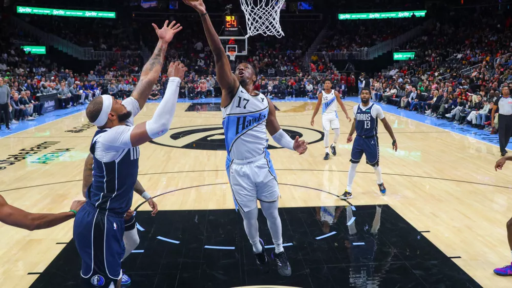 Nov 25, 2024; Atlanta, Georgia, USA; Atlanta Hawks forward Onyeka Okongwu (17) shoots against the Dallas Mavericks in the first half at State Farm Arena. Mandatory Credit: Brett Davis-Imagn Images