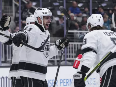 Los Angeles Kings center Anze Kopitar (11) reacts after scoring a goal during the second period of an NHL hockey game against the San Jose Sharks, Monday, Nov. 25, 2024, in San Jose, Calif. (AP Photo/Godofredo A. Vásquez)