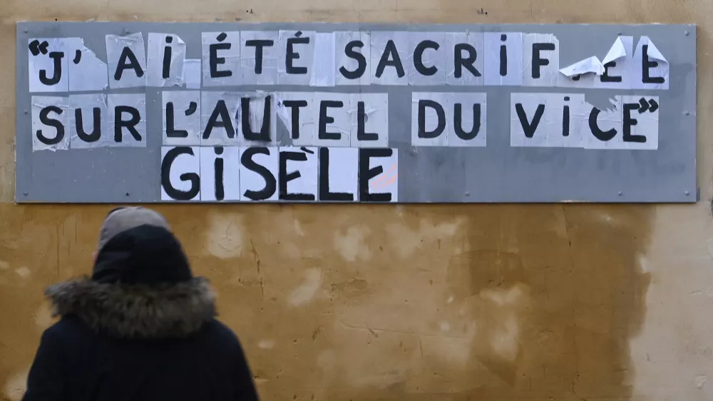 The slogan which reads "I was sacrificed on the altar of vice, Gisele" is seen on a city wall during the trial of Dominique Pelicot, a Frenchman accused of drugging his then-wife Gisele Pelicot and recruiting dozens of strangers to rape her at their home in the southern French town of Mazan, and 50 co-accused, with 50 co-accused, in Avignon, France, November 26, 2024. REUTERS/Alexandre Dimou