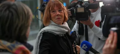 Frenchwoman Gisele Pelicot, the victim of an alleged mass rape orchestrated by her then-husband Dominique Pelicot at their home in the southern French town of Mazan, arrives in court surrounded by journalists as prosecutors say what sentences they are seeking in the trial for Dominique Pelicot and 50 co-accused, at the courthouse in Avignon, France, November 26, 2024. REUTERS/Alexandre Dimou