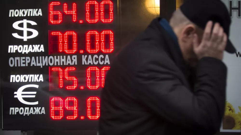 ﻿Signs advertising currencies light next to the exchange office in Moscow, Russia, Tuesday, Dec. 16, 2014. After a massive overnight rate hike by Russia's Central Bank, the ruble staged a two-hour rally Tuesday morning before rolling back to new historic lows. The surprise Central Bank decision to raise the rate to 17 percent from 10.5 percent came in the early hours on Tuesday in a desperate attempt to prop up the troubled currency. It's the biggest interest rate hike since 1998, the year when Russia defaulted on its sovereign bonds.(AP Photo / Alexander Zemlianichenko)