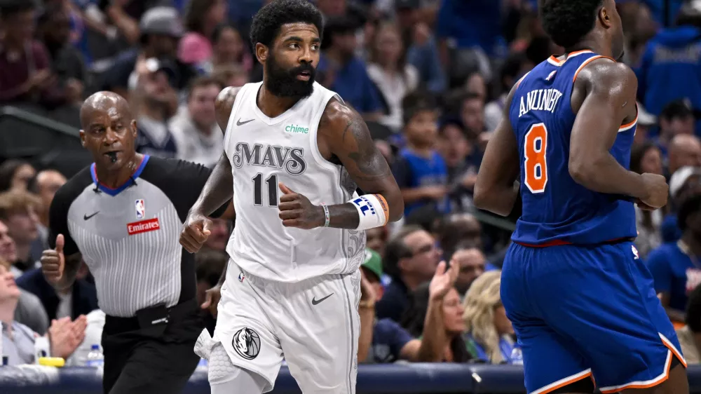 Nov 27, 2024; Dallas, Texas, USA; Dallas Mavericks guard Kyrie Irving (11) runs back up the court after scoring against the New York Knicks during the second half at the American Airlines Center. Mandatory Credit: Jerome Miron-Imagn Images