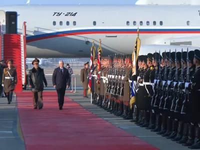 In this photo taken from a video released by Russian Defense Ministry press service, Russian Defense Minister Andrei Belousov, right on the red carpet, is welcomed by North Korean Defense Minister No Kwang Chol, left on the red carpet, upon his arrival at Pyongyang International Airport outside of Pyongyang, North Korea Friday, Nov. 29, 2024. (Russian Defense Press Service via AP)