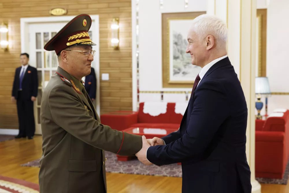 In this photo released by Russian Defense Ministry press service, North Korean Defense Minister No Kwang Chol, left, and Russian Defense Minister Andrei Belousov, right, shake hands during their meeting in Pyongyang, North Korea, Friday, Nov. 29, 2024. (Vadim Savitsky, Russian Defense Ministry Press Service via AP)