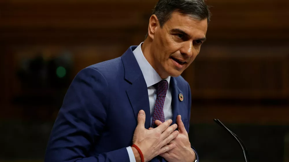 Spanish Prime Minister Pedro Sanchez speaks to Spain's opposition leader and People's Party president Alberto Nunez Feijoo (not pictured) as he addresses lawmakers about the government action during the floods in eastern Spain, at Parliament in Madrid, Spain, November 27, 2024. REUTERS/Susana Vera