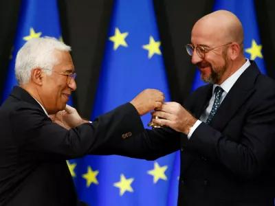 European Council incoming President Antonio Costa and outgoing President Charles Michel hold a bell during the ceremonial handover of the presidency, at the European Council headquarters in Brussels, Belgium November 29, 2024. REUTERS/Johanna Geron