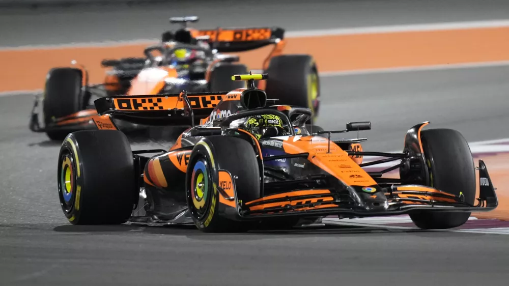 McLaren driver Lando Norris of Britain leads his teammate McLaren driver Oscar Piastri of Australia during sprint race at the Formula One Qatar Grand Prix, at the Lusail International Circuit in Lusail, Qatar, Saturday, Nov. 30, 2024. (AP Photo/ Darko Bandic)