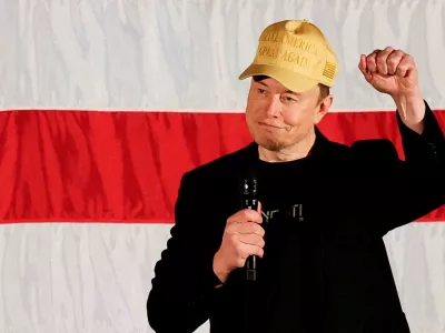 FILE PHOTO: Tesla CEO and X owner Elon Musk, who supports Republican presidential nominee former U.S. President Donald Trump, gestures as he speaks about voting during an America PAC Town Hall in Folsom, Pennsylvania, U.S., October 17, 2024. REUTERS/Rachel Wisniewski/File Photo