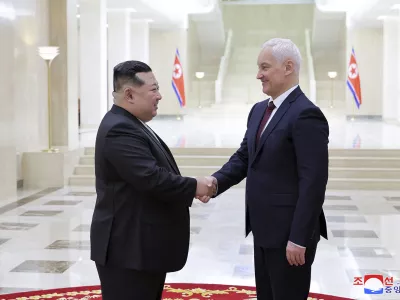 In this photo provided by the North Korean government, North Korean leader Kim Jong Un, left, shakes hands with Russian Defense Minister Andrei Belousov in Pyongyang, North Korea Friday, Nov. 29, 2024. Independent journalists were not given access to cover the event depicted in this image distributed by the North Korean government. The content of this image is as provided and cannot be independently verified. Korean language watermark on image as provided by source reads: "KCNA" which is the abbreviation for Korean Central News Agency. (Korean Central News Agency/Korea News Service via AP)