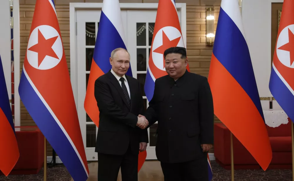 FILED - 18 June 2024, North Korea, Pyongyang: Russian President Vladimir Putin and North Korean leader Kim Jong Un shake hands a head of their meeting during Putin's two day state visit. North Korea "will invariably support the policy of the Russian Federation to defend its sovereignty and territorial integrity from the imperialists' moves for hegemony," Kim was quoted by North Korean state media on 30 Novemeber. Photo: -/Kremlin/dpa - ATTENTION: editorial use only and only if the credit mentioned above is referenced in full