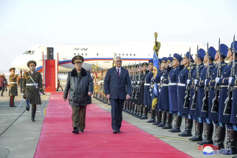 In this photo provided by the North Korean government, Russian Defense Minister Andrei Belousov, center right, with North Korean Defense Minister No Kwang Chol, center left, is welcomed on his arrival at a Pyongyang airport, North Korea Friday, Nov. 29, 2024. Independent journalists were not given access to cover the event depicted in this image distributed by the North Korean government. The content of this image is as provided and cannot be independently verified. Korean language watermark on image as provided by source reads: "KCNA" which is the abbreviation for Korean Central News Agency. (Korean Central News Agency/Korea News Service via AP)