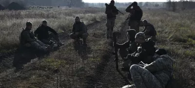 In this photo provided by the Ukraine's 65th Mechanised Brigade press service on Nov. 19, 2024, Ukrainian soldiers rest during a training at a polygon in Zaporizhzhia region, Ukraine. (Andriy Andriyenko/Ukraine's 65th Mechanised Brigade via AP)