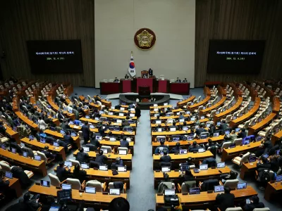 Lawmakers sit inside the hall at the National Assembly, after South Korean President Yoon Suk Yeol declared martial law, in Seoul, South Korea, December 4, 2024. REUTERS/Kim Hong-Ji