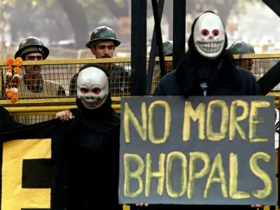 Activists from Greenpeace stage a protest in front of parliament in New Delhi Friday December 3, 1999 on the 15th anniversary of the Union Carbide disaster in Bhopal which killed close to 7,000 people. Greenpeace claims that Union Carbide left behind toxic wastes at the site of the disaster and that few steps are being taken globally to keep incidents like Bhopal from happening again. Activists claim that toxic wastes from the Union Carbide accident have leaked into the groundwater supply in Bhopal, leaving behind a dangerous legacy 15 years after the event. (AP Photo/John McConnico)