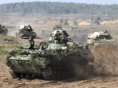 ﻿In this photo taken on Monday, Sept. 11, 2017, Belarusian army vehicles drive preparing for war games at an undisclosed location in Belarus. Russia and Belarus are holding a massive war games, Zapad 2017, that due to start on Thursday near the borders of Poland, Estonia, Latvia and Lithuania. (Vayar Military Agency photo via AP)