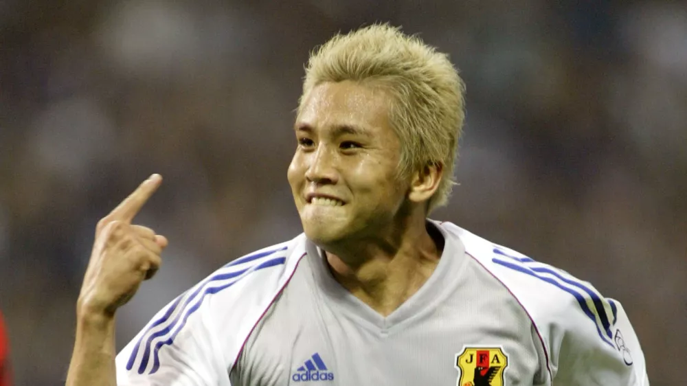 Japanese player Junichi Inamoto celebrates the 2-1 he scored for his team during a 2002 World Cup Group H match Japan vs Belgium in Saitama, Japan, Tuesday, June 4, 2002. The match ended 2-2. The other teams playing in Group H are Russia and Tunisia. (AP Photo/David Guttenfelder)