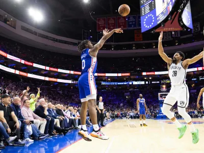 Apr 17, 2023; Philadelphia, Pennsylvania, USA; Philadelphia 76ers guard Tyrese Maxey (0) scores a three pointer in front of Brooklyn Nets guard Spencer Dinwiddie (26) during the fourth quarter in game two of the 2023 NBA playoffs at Wells Fargo Center. Mandatory Credit: Bill Streicher-USA TODAY Sports