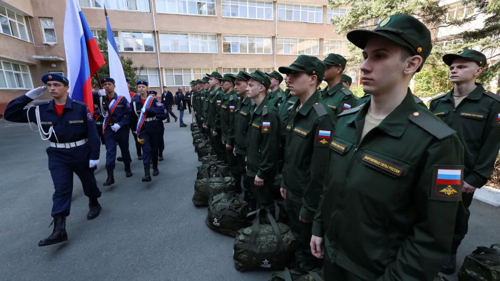 Russian conscripts called up for military service line up before their departure for garrisons as they gather at a recruitment centre in Simferopol, Crimea, April 25, 2023. REUTERS/Alexey Pavlishak