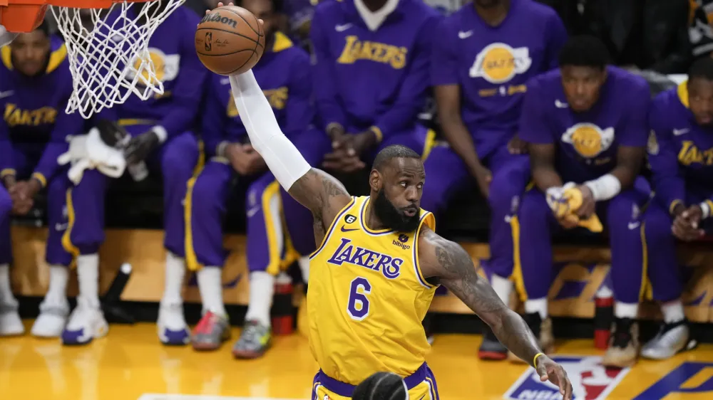 Los Angeles Lakers' LeBron James grabs a rebound during the first half in Game 6 of the team's first-round NBA basketball playoff series against the Memphis Grizzlies on Friday, April 28, 2023, in Los Angeles. (AP Photo/Jae C. Hong)