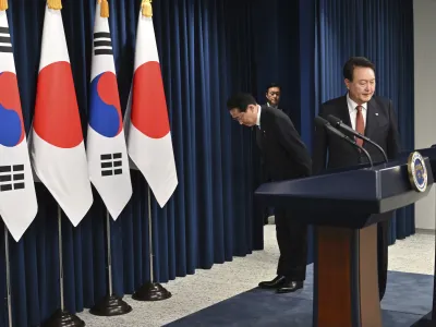 South Korean President Yoon Suk Yeol, right, and Japanese Prime Minister Fumio Kishida attend a joint press conference after their meeting at the presidential office in Seoul Sunday, May 7, 2023. The leaders of South Korea and Japan met Sunday for their second summit in less than two months, as they push to mend long-running historical grievances and boost ties in the face of North Korea's nuclear program and other regional challenges. (Jung Yeon-je/Pool Photo via AP)