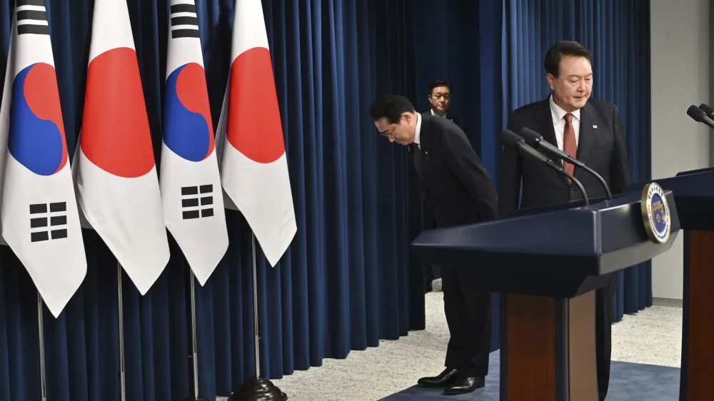 South Korean President Yoon Suk Yeol, right, and Japanese Prime Minister Fumio Kishida attend a joint press conference after their meeting at the presidential office in Seoul Sunday, May 7, 2023. The leaders of South Korea and Japan met Sunday for their second summit in less than two months, as they push to mend long-running historical grievances and boost ties in the face of North Korea's nuclear program and other regional challenges. (Jung Yeon-je/Pool Photo via AP)