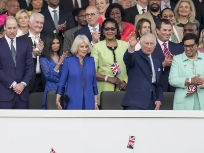 07 May 2023, United Kingdom, Windsor: King Charles III, flanked by Queen Camilla (L) and Patricia Scotland, Baroness Scotland (R), waves from the Royal Box during the Coronation Concert held in the grounds of Windsor Castle, to celebrate the coronation of King Charles III and Queen Camilla. Photo: Kin Cheung/PA Wire/dpa