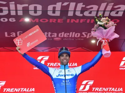 Cycling - Giro d'Italia - Stage 3 - Vasto to Melfi - Italy - May 8, 2023 Team Jayco AlUla's Michael Matthews celebrates on the podium after winning stage 3 REUTERS/Jennifer Lorenzini