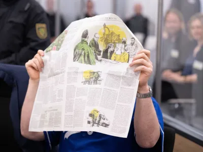 A defendant hides his face in the courtroom of the Higher Regional Court before the verdict over a jewellery heist on the Green Vault museum in Dresden's Royal Palace, in Dresden, Germany on May 16, 2023. Sebastian Kahnert/Pool via REUTERS   ATTENTION EDITORS - PARTS OF THE IMAGE HAVE BEEN PIXELATED AT SOURCE. GERMAN COURT REQUESTS THAT THE FACE OF DEFENDANTS MUST BE MADE UNRECOGNISABLE