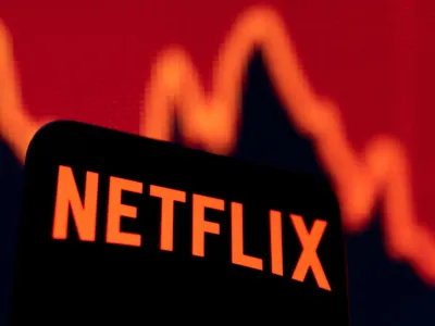 Smartphone with Netflix logo is seen in front of a descending stock graph in this illustration taken April 19, 2022. REUTERS/Dado Ruvic/Illustration