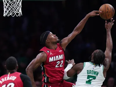 May 19, 2023; Boston, Massachusetts, USA; Miami Heat forward Jimmy Butler (22) defends a shot by Boston Celtics guard Jaylen Brown (7) during the second half of game two of the Eastern Conference Finals for the 2023 NBA playoffs at TD Garden. Mandatory Credit: David Butler II-USA TODAY Sports