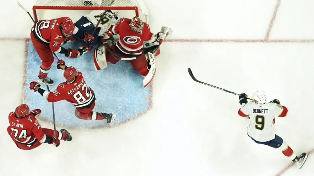 May 20, 2023; Raleigh, North Carolina, USA; Carolina Hurricanes goaltender Antti Raanta (32) makes a save off a shot by Florida Panthers center Sam Bennett (9) during the first period in game two of the Eastern Conference Finals of the 2023 Stanley Cup Playoffs at PNC Arena. Mandatory Credit: James Guillory-USA TODAY Sports