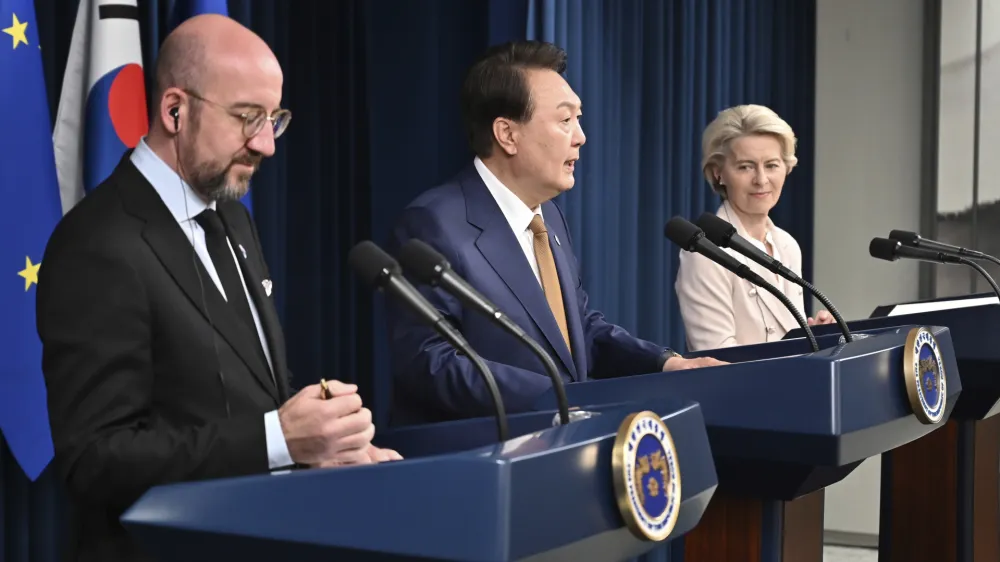 Charles Michel, left, President of the European Council, South Korea's President Yoon Suk Yeol, center, and Ursula von der Leyen, right, President of the European Commission, address the media during a joint press conference after their meeting at the Presidential Office in Seoul, South Korea, Monday, May 22, 2023. (Photo by Jung Yeon-je/Pool Photo via AP)