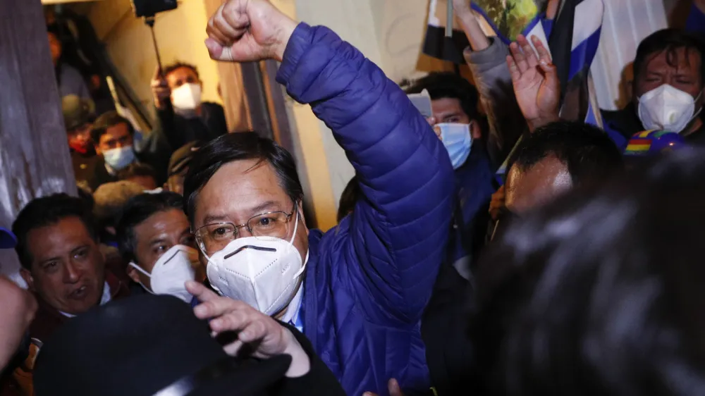 ﻿Luis Arce, presidential candidate for the Movement Towards Socialism (MAS) party, raises his fist as he claims victory after general elections in La Paz, Bolivia, Monday, Oct. 19, 2020. (AP Photo/Juan Karita)