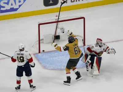 Vegas Golden Knights right wing Mark Stone (61) celebrates his goal as Florida Panthers goaltender Sergei Bobrovsky (72) gets up during the third period of Game 1 of the NHL hockey Stanley Cup Finals, Saturday, June 3, 2023, in Las Vegas. The Golden Knights defeated the Panthers 5-2. (AP Photo/John Locher)