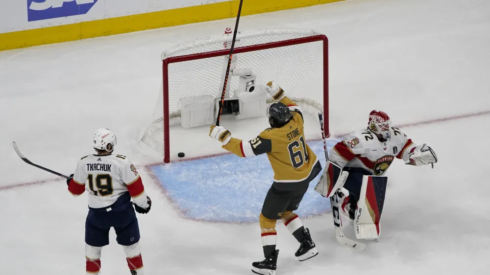 Vegas Golden Knights right wing Mark Stone (61) celebrates his goal as Florida Panthers goaltender Sergei Bobrovsky (72) gets up during the third period of Game 1 of the NHL hockey Stanley Cup Finals, Saturday, June 3, 2023, in Las Vegas. The Golden Knights defeated the Panthers 5-2. (AP Photo/John Locher)