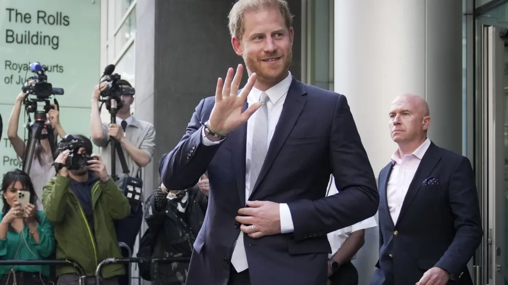 Prince Harry leaves the High Court after giving evidence in London, Wednesday, June 7, 2023. Prince Harry has given evidence from the witness box and has sworn to tell the truth in testimony against a tabloid publisher he accuses of phone hacking and other unlawful snooping. He alleges that journalists at the Daily Mirror and its sister papers used unlawful techniques on an "industrial scale" to get scoops. Publisher Mirror Group Newspapers is contesting the claims. (AP Photo/Kin Cheung)