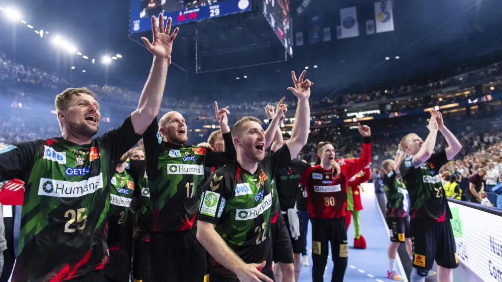 Magdeburg's players celebrate winning the Final Four Champions League handball final match against KS Kielce at Lanxess Arena in Cologne, Germany, Sunday June 18, 2023. (Marius Becker/dpa via AP)