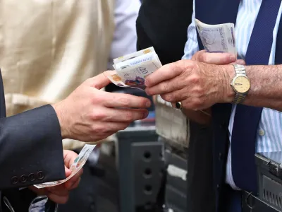 Horse Racing - Royal Ascot - Ascot Racecourse, Ascot, Britain - June 24, 2023 General view as money is handed over at Royal Ascot after the 15:05 Jersey Stakes REUTERS/Andrew Boyers