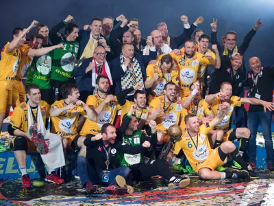 ﻿In this Sunday, May 29, 2016 photo the team of Kielce celebrate after winning the Handball Champions League EHF Final Four final between KS Vive Kielce and MKB Veszprem in Cologen, western Germany. (Marius Becker/dpa via AP)