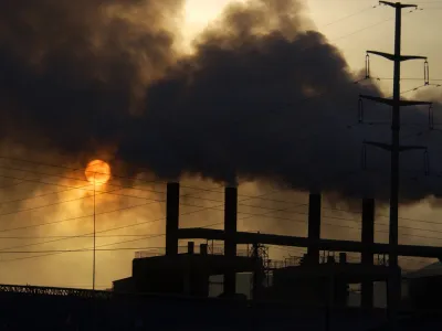 ** FILE ** Clouds of smoke billow from a metal alloy factory in Gaolan county in northwest China's Gansu province in this Nov. 7, 2006 file photo. The world's leading climate scientists, in their most powerful language ever used on the issue, said Friday Feb. 2, 2007, that global warming has started and is "very likely" manmade. The report from the Intergovernmental Panel on Climate Change - a group of hundreds of scientists and representatives of 113 governments - said global warming will continue for hundreds of years, no matter how much humans control their pollution. China is the second largest emitter of greenhouse gases, after the United States. (AP Photo) ** CHINA OUT **