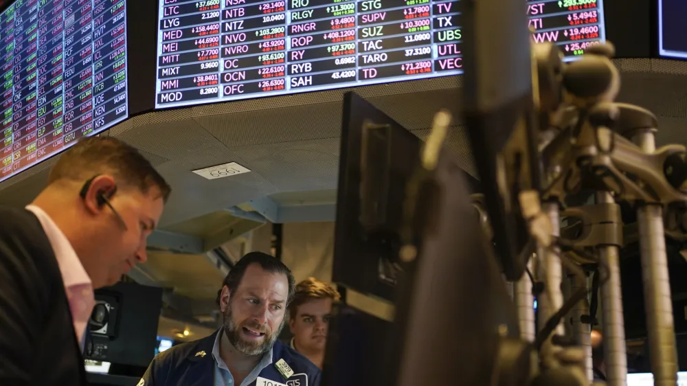 FILE - Traders work on the floor at the New York Stock Exchange in New York, May 19, 2022. Stocks are opening lower on Wall Street Tuesday, May 24, 2022 led by drops in tech heavyweights like the parent companies of Facebook and Google. The S&P 500 index fell 1.2% in the early going, and the tech-heavy Nasdaq was down almost twice as much, 2.3%. (AP Photo/Seth Wenig)